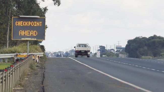 Drivers get a checkpoint warning approaching from Melbourne. Police and army are running a COVID-19 checkpoint at Little River preventing lockdown Melbourne residents from entering the Geelong region. Picture: Alan Barber