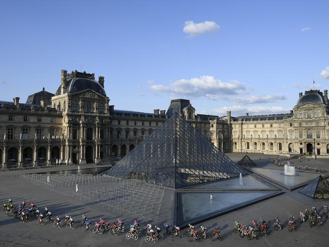 The peloton rides past the pyramid at the Louvre in 2019. Picture: AP.