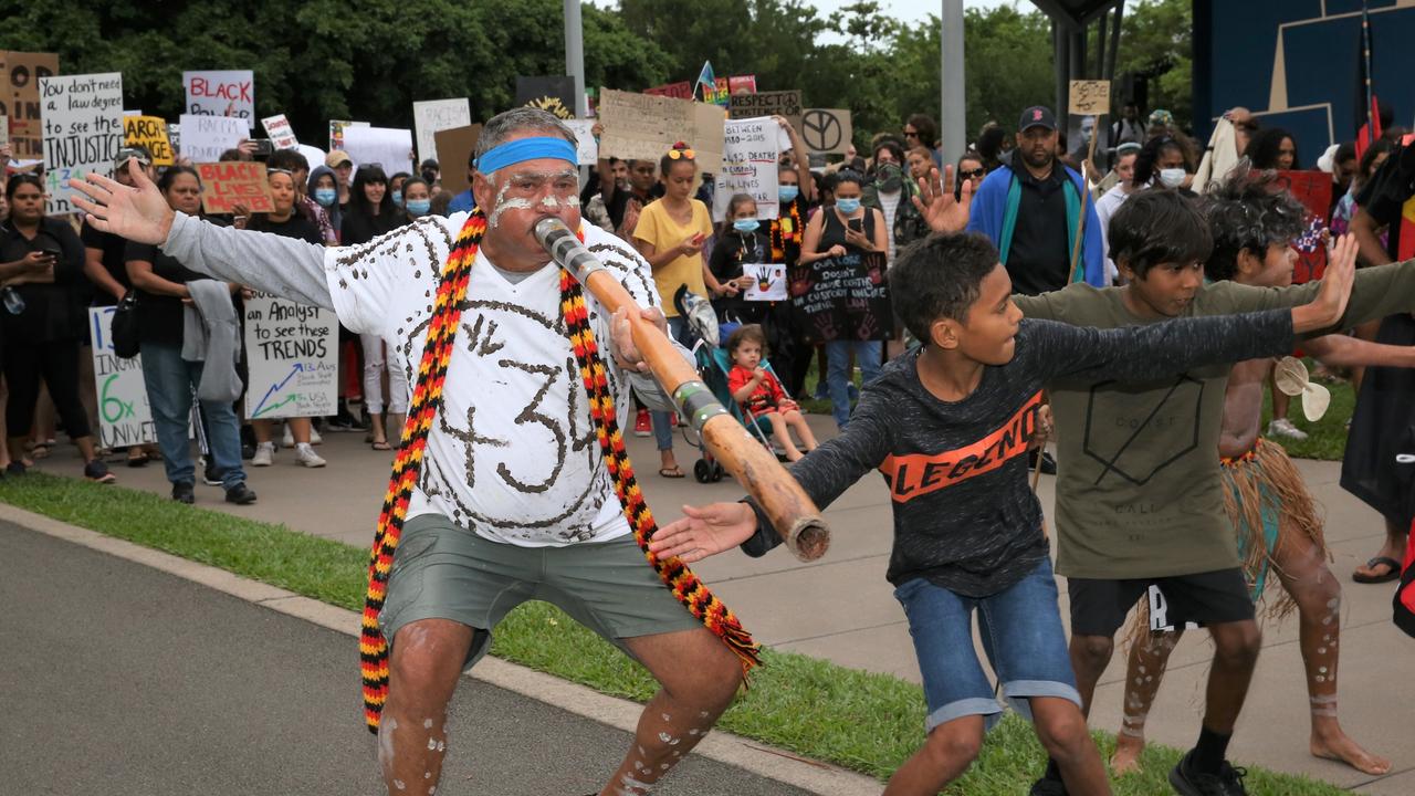 Mala Neal from Yarrabah leads protesters from Fogarty Park down Spence St during the Cairns Black Lives Matter protest on Sunday. Picture: PETER CARRUTHERS