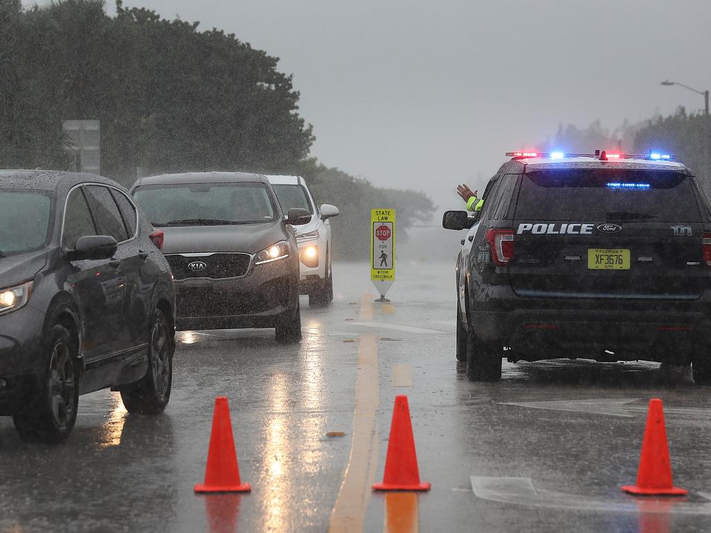 Police encourage locals to leave the area. Picture: Getty Images/AFP