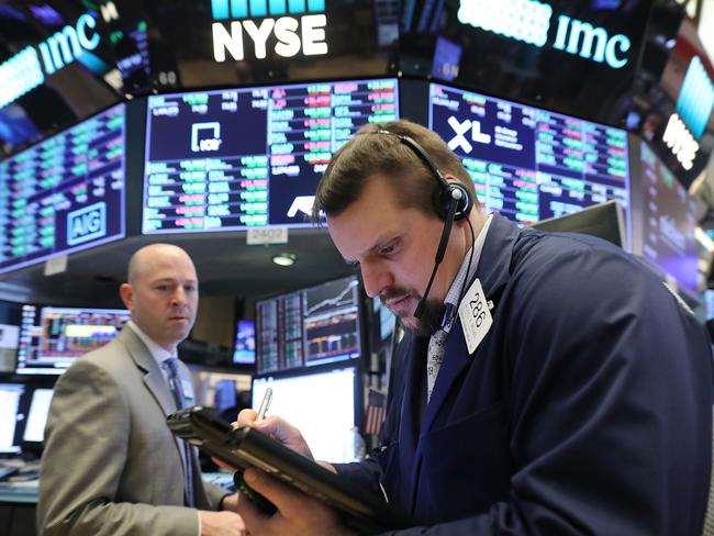 Traders on the floor of the New York Stock Exchange on Friday