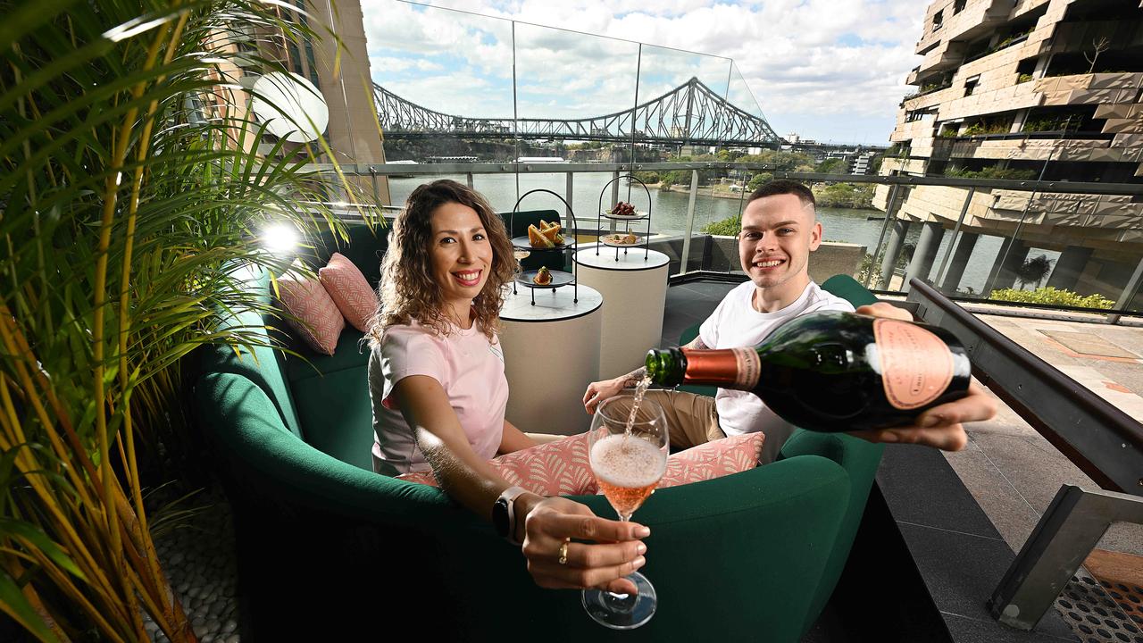 Hostess Romina Vanzella and mixologist Declan John Watts inside the new The Aviary terrace bar, in Brisbane City. Picture: Lyndon Mechielsen