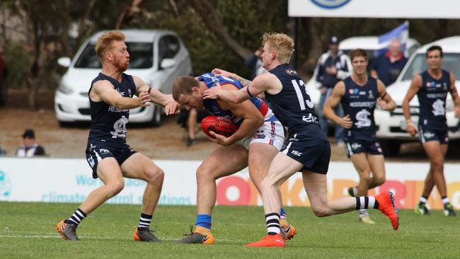 South’s Nick Liddle and Mark Noble swarm Central’s Jordan Furnell. Picture: AAP Image/Russell Millard