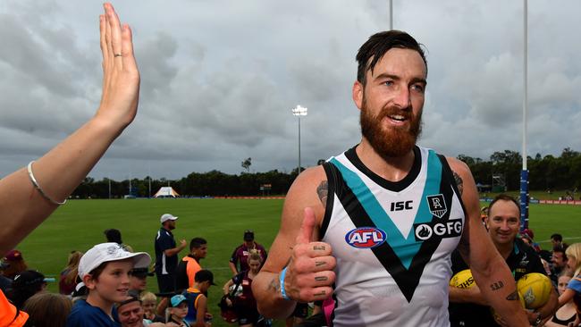 Charlie Dixon celebrates with fans after the win over Brisbane. Picture: AAP Image/Darren England.