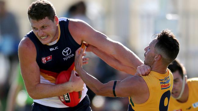 10/04/16 SANFL: Eagles v Adelaide at Woodville Oval. Luke Lowden fends off James Boyd. photo Calum Robertson