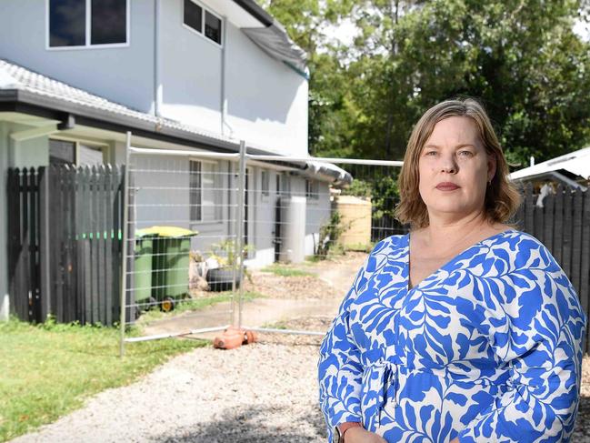 Arana Hills resident Jodie Davis has been forced out of her home after a tree from a neighbouring property crashed through the roof, triggering a dispute over who owns the tree. Picture: Patrick Woods.