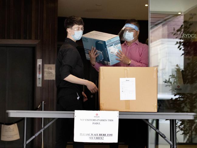 Staff at Rydges on Swanston hotel in Melbourne receive a delivery of PPE. Picture: NCA NewsWire / David Geraghty