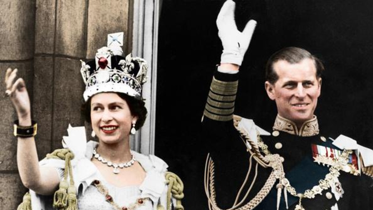 Queen Elizabeth II and the Duke of Edinburgh on the day of their coronation at Buckingham Palace in 1953. Picture: The Print Collector/Getty Images