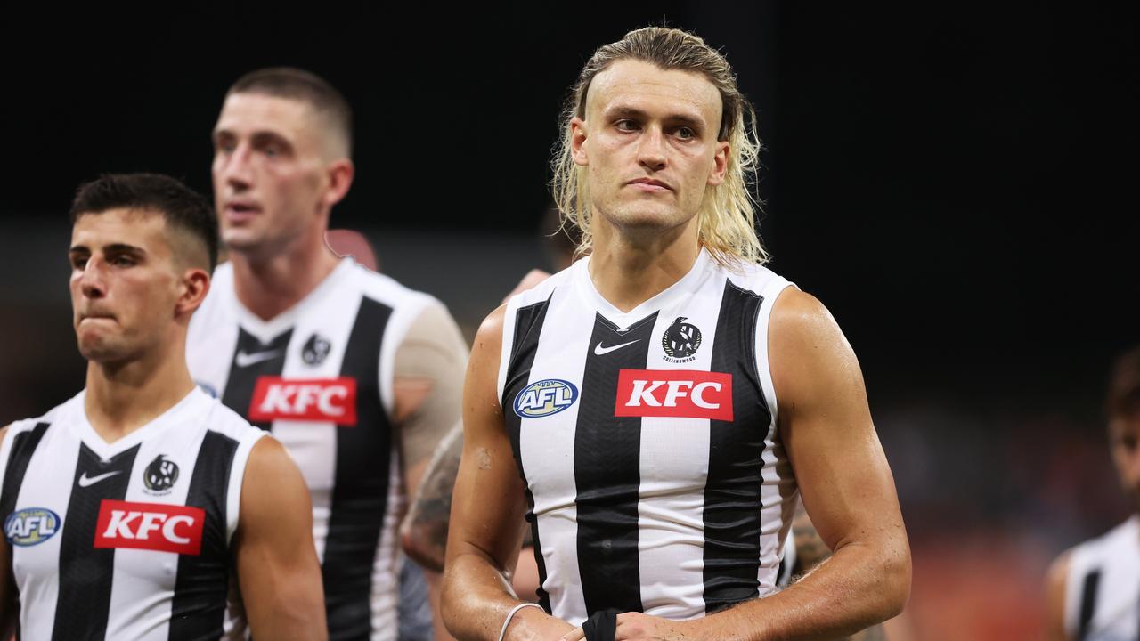 SYDNEY, AUSTRALIA - MARCH 09: Darcy Moore of the Magpies and team mates look dejected after the AFL Opening Round match between Greater Western Sydney Giants and Collingwood Magpies at ENGIE Stadium, on March 09, 2024, in Sydney, Australia. (Photo by Matt King/AFL Photos/via Getty Images )