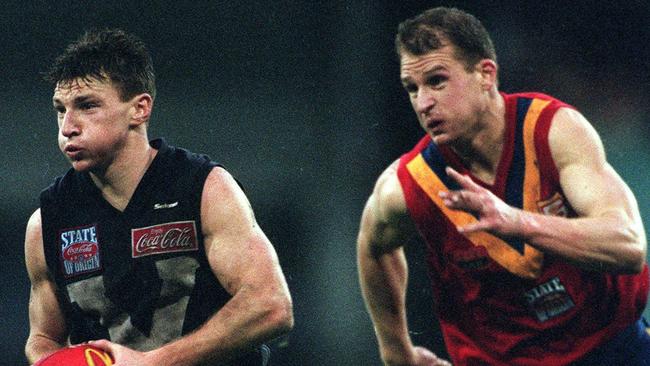 Brent Harvey races clear of Sean Wellman in the most recent State of Origin match in 1999.