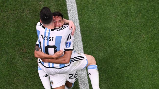 Nahuel Molina (back) celebrates the opener with Lionel Messi. (Photo by Kirill KUDRYAVTSEV / AFP)