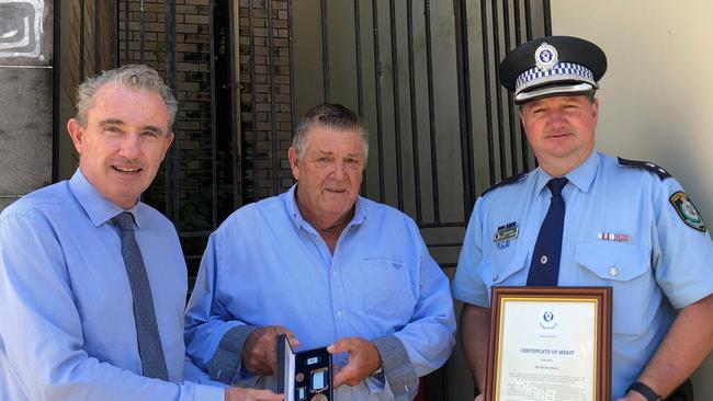 BRAVEHEART: Kevin Dowd's selfless act in rescuing a burning man from his car shortly before it exploded was recognised with a a Royal Humane Society of NSW Bronze Medal Bravery Award presented by Federal Member for Page Kevin Hogan. Richmond Police District Commander Superintendent Scott Tanner also presented Mr Dowd with a commendation. Photo: Alison Paterson