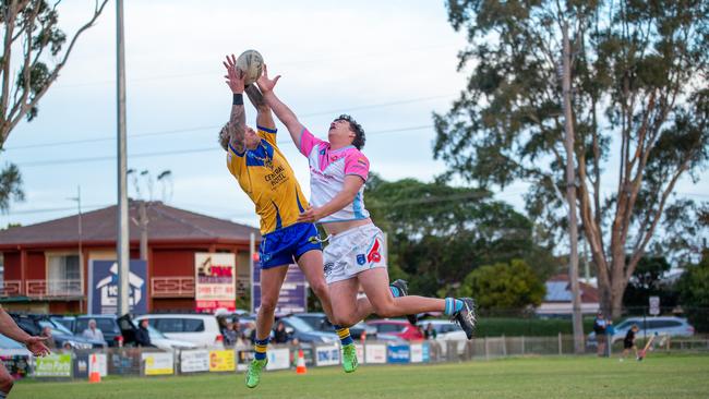 Kye Deane and Jarrah Treweek compete for a high ball on the goal line. Picture: Thomas Lisson