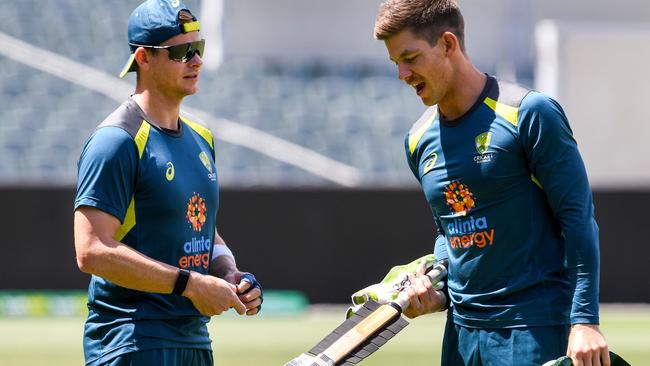 Australian captain Tim Paine (right) chats with batsman Steve Smith during a training session at Adelaide Oval on Thursday. Picture: AFP