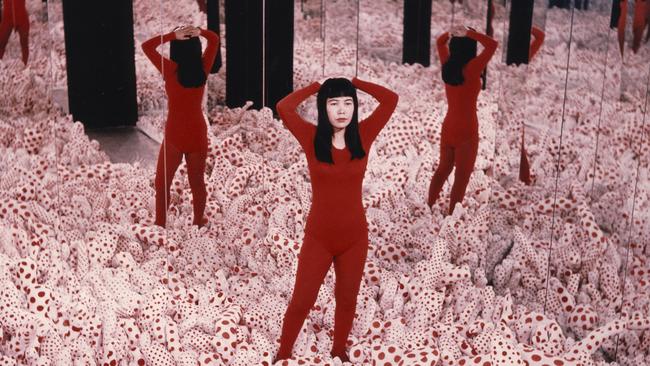 Yayoi Kusama in her Infinity Mirror Room.