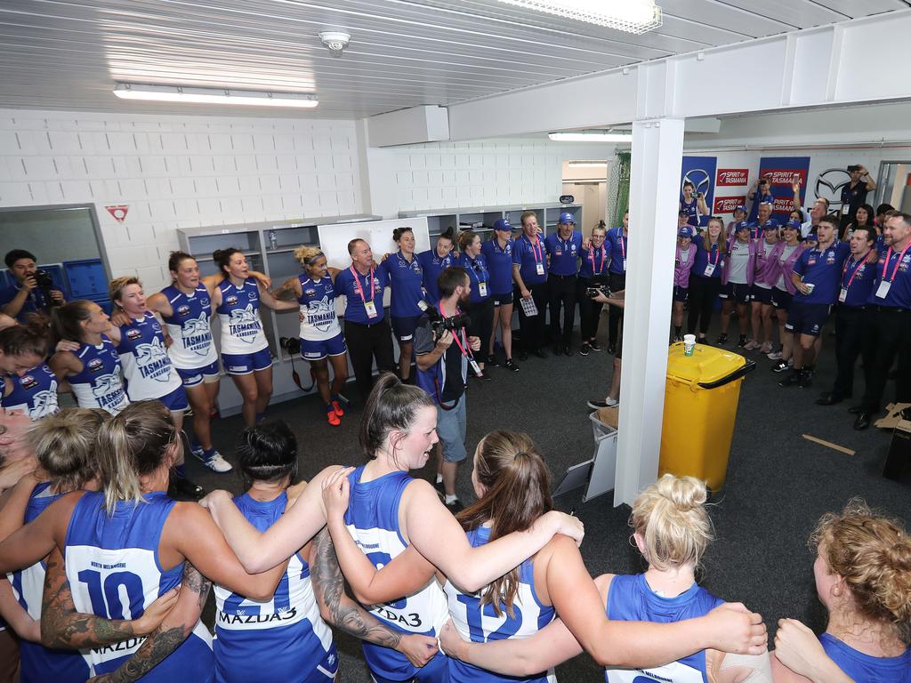 North Melbourne sing its team song after winning its debut AFLW match. Picture: LUKE BOWDEN