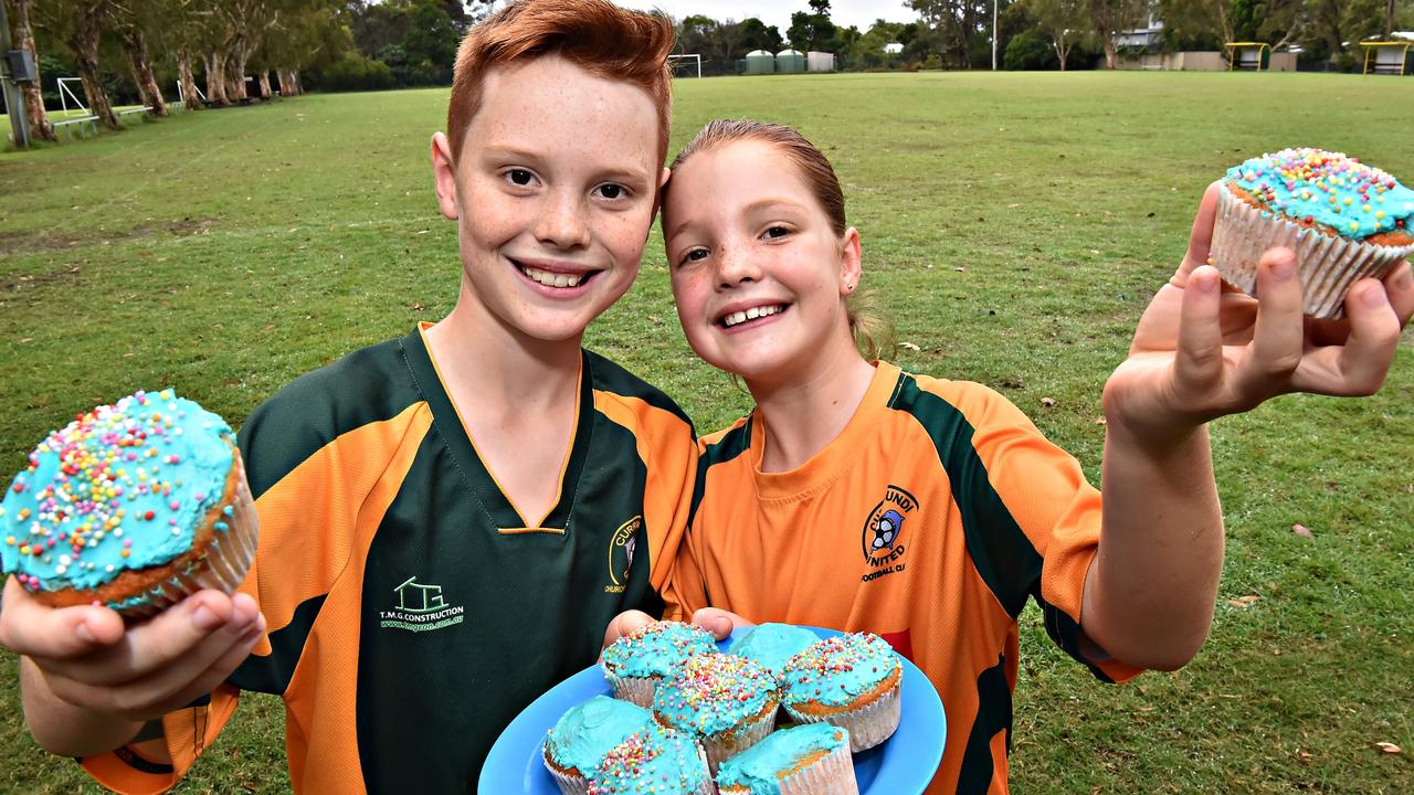 Currimundi United Football Club players Finn, 10, and Ivy, 9, helped sell cupcakes to raise money for mental health charity Beyond Blue in 2019.