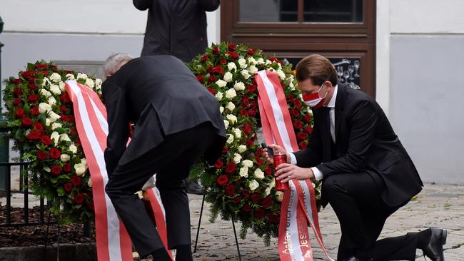 Alexander Van der Bellen and Sebastian Kurz lay wreaths in central Vienna on Wednesday. Picture: Getty Images