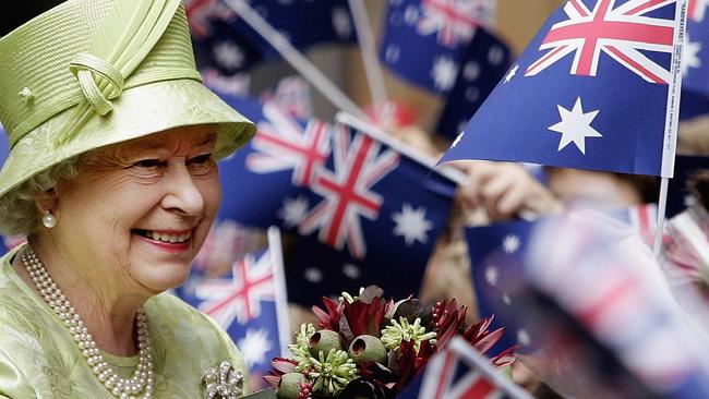 UPLOADED IMAGE -  SYDNEY, NSW - MARCH 13:  Her Majesty Queen Elizabeth ll smiles amongst Australian flags being waved by the crowd after the Commonwealth Day Service March 13, 2006 in Sydney, Australia. The Queen and Prince Philip are on a five-day visit to Australia where she will officially open the Commonwealth Games in Melbourne.        (Photo by Rob Griffith-Pool/Getty Images)