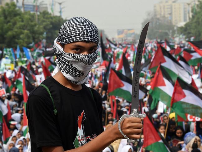 A student holds a dummy sword during a rally in support of Palestinians, in Karachi on November 8, 2023. Thousands of civilians, both Palestinians and Israelis, have died since October 7, 2023, after Palestinian Hamas militants based in the Gaza Strip entered southern Israel in an unprecedented attack triggering a war declared by Israel on Hamas with retaliatory bombings on Gaza. (Photo by Asif HASSAN / AFP)