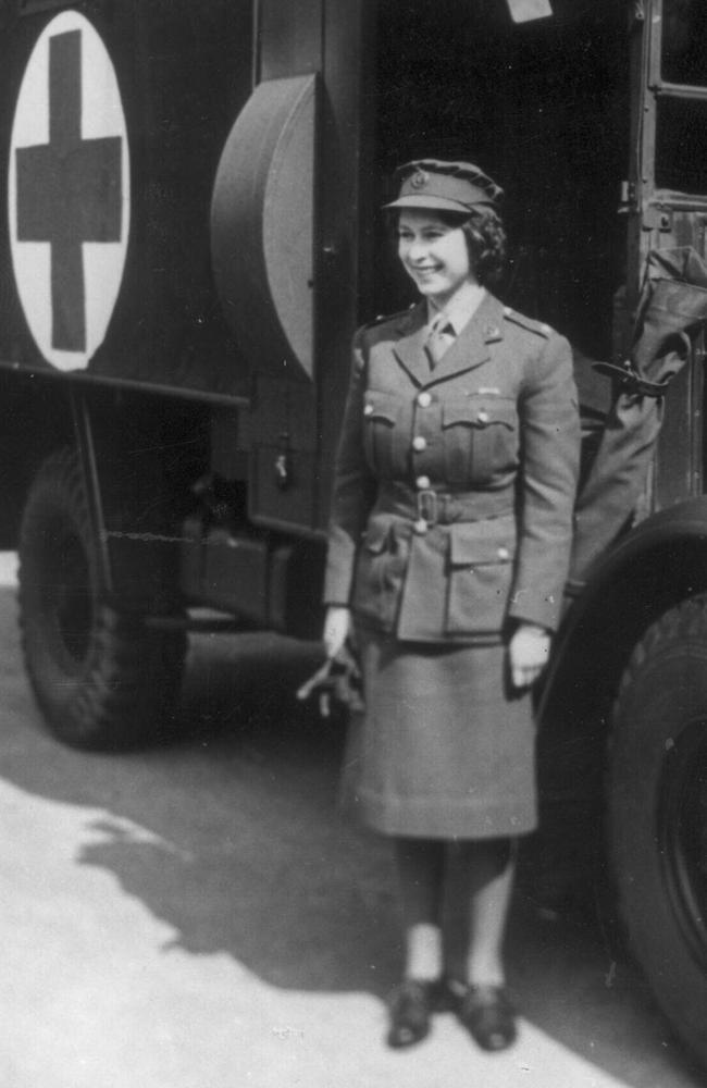 Princess Elizabeth, later Queen Elizabeth II, standing in front of an army truck during World War 2. She was undergoing ATS training in Surrey, southern England.