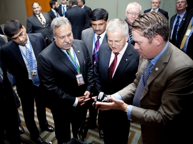 AFP Agent Danny Caruana took this photo of his friend Fayyaz Sumbal, far left, at a bomb data conference in Sydney in 2012.