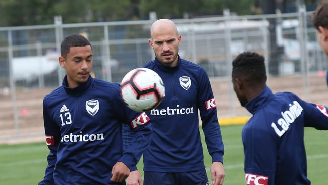 Rising Melbourne Victory player Birkan Kirdar (L) has big wraps on him. Picture: AAP