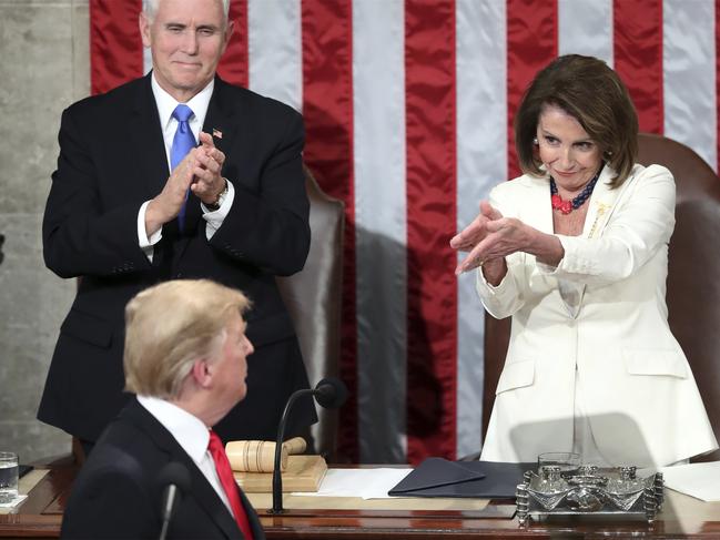 President Donald Trump turns to House speaker Nancy Pelosi of Calif., as he delivers his State of the Union address to a joint session of Congress on Capitol Hill in Washington, as Vice President Mike Pence watches, Tuesday, Feb. 5, 2019. (AP Photo/Andrew Harnik)