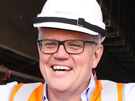 POOL PHOTO: Prime Minister Scott Morrison poses for a photo while on a tour of the Snowy Hydro Lobs Hole site, during his visit for the commissioning of a second tunnel boring machine, on Friday 3 December 2021. Pool photo: Alex Ellinghausen