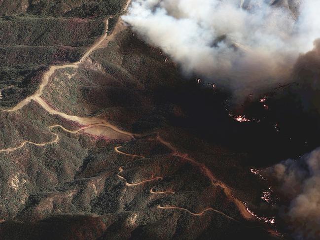 In this photo provide by Maxar Technologies, the Palisades fire burns south of the Encino Reservoir. Picture: Maxar Technologies via AP