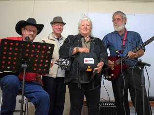 CLASSIC COUNTRY: Rob McCalister and Henry Wilson with Cammie and Charlie Bastow with the new defibrillator machine. Picture: Kate McCormack