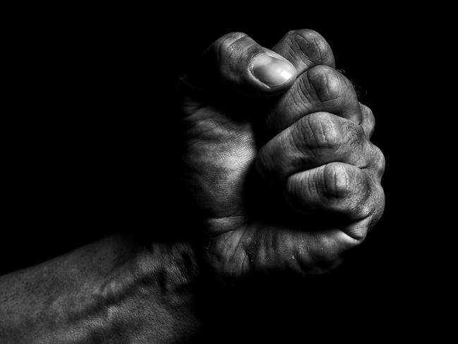 Clenched fist on a black background