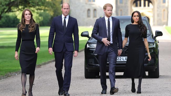 WINDSOR, ENGLAND - SEPTEMBER 10: Catherine, Princess of Wales, Prince William, Prince of Wales, Prince Harry, Duke of Sussex, and Meghan, Duchess of Sussex on the long Walk at Windsor Castle on September 10, 2022 in Windsor, England. Crowds have gathered and tributes left at the gates of Windsor Castle to Queen Elizabeth II, who died at Balmoral Castle on 8 September, 2022. (Photo by Chris Jackson - WPA Pool/Getty Images)