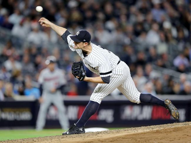 NEW YORK, NY - OCTOBER 03: David Robertson #30 of the New York Yankees throws a pitch against the Minnesota Twins during the fifth inning in the American League Wild Card Game at Yankee Stadium on October 3, 2017 in the Bronx borough of New York City.   Elsa/Getty Images/AFP == FOR NEWSPAPERS, INTERNET, TELCOS & TELEVISION USE ONLY ==