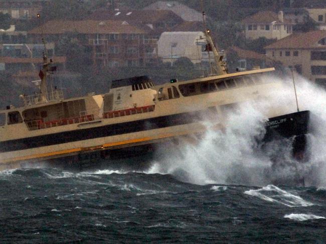 Gale force south east winds hit Sydney causing damage to some suburbs large seas and sand storms along the beaches. The Manly Ferry 'Queenscliff' gets a pounding travelling from Manly to the City. Wet weather. Storm.