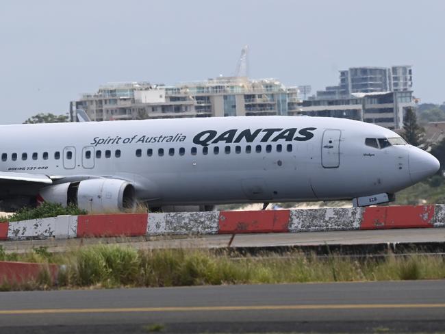 Qantas plane arrives at the International airport after a MAY DAY Alert was called . Photo Jeremy Piper