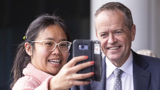 Leader of the Opposition Bill Shorten (right) poses for a selfie with a member of the public following a tour of Monash Children's Hospital, in Clayton, Melbourne, Monday, August 27, 2018. (AAP Image/Daniel Pockett) NO ARCHIVING