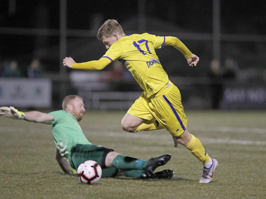 Lokoseljac Cup Final at KGV. Devonport Strikers versus South Hobart. Devonport's Max Fitzgerald beats South Hobart goal keeper Graham Wright. Picture: PATRICK GEE