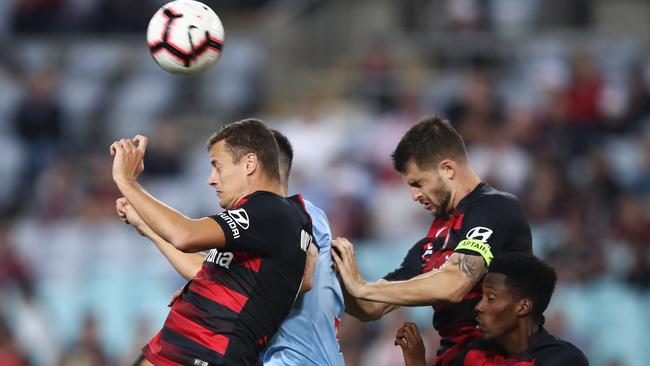 Wanderers striker Oriol Riera heads the ball. Picture: AAP