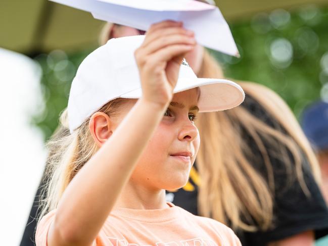 Madi Black flying a paper plane at Wellcamp Airport 10th anniversary community day, Sunday, November 10, 2024. Picture: Kevin Farmer