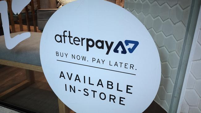 An Afterpay sign is seen in a store window in a shopping centre in Sydney. Picture: AAP Image/Derek Rose.