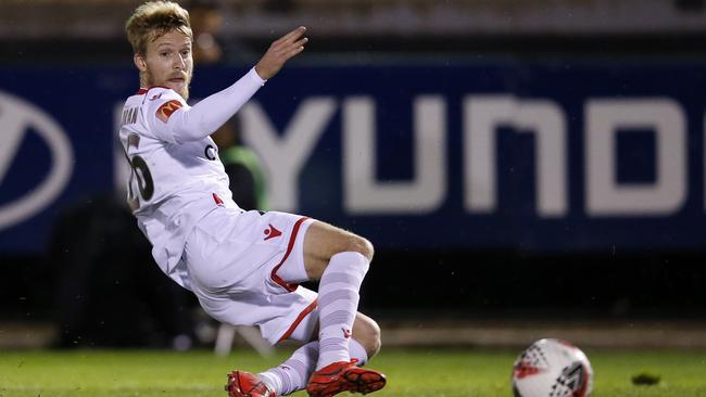 Ben Halloran scores the first of his two goals in Adelaide United’s FFA Cup round-of-32 victory over Melbourne Knights. Picture: Darrian Traynor/Getty Images