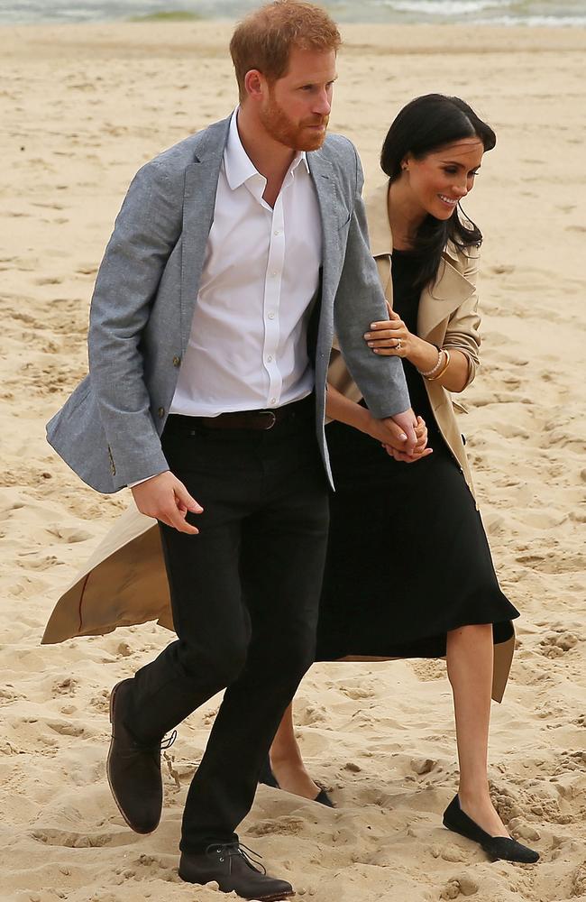 A trip to the beach in South Melbourne didn’t stop Meghan Markle from wearing her usual style of clothing — a midi-dress. Picture: Getty Images