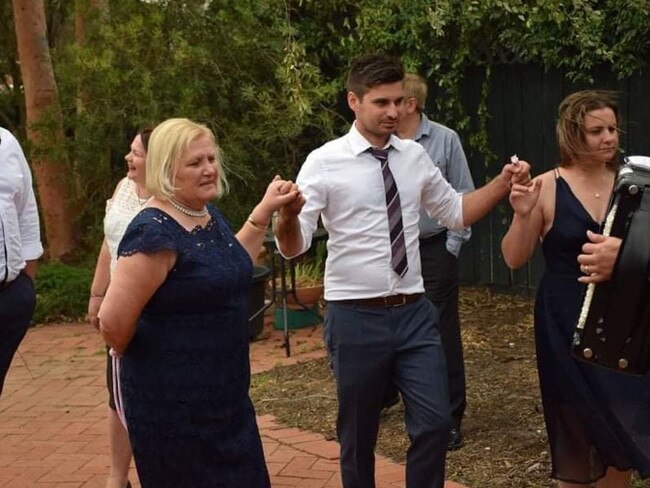 Nada Stoyanovski dancing at her granddaughter's christening