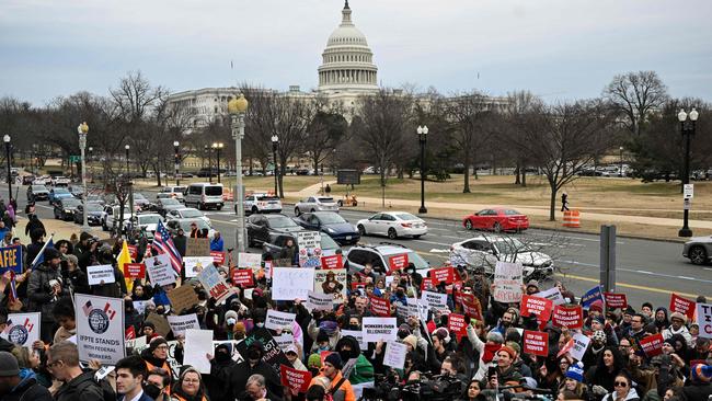 People protest against Elon Musk's DOGE outside of the US Department of Labor. Picture: AFP.