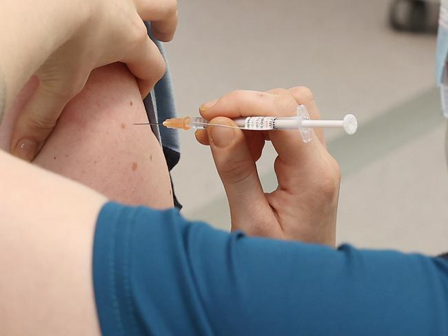 The Covid19 Vaccination Centre at Sydney Olympic Park has opened today and people are lined around the block to get their shots. Front line workers such as police will be the first to get their vaccinations Picture: David Swift