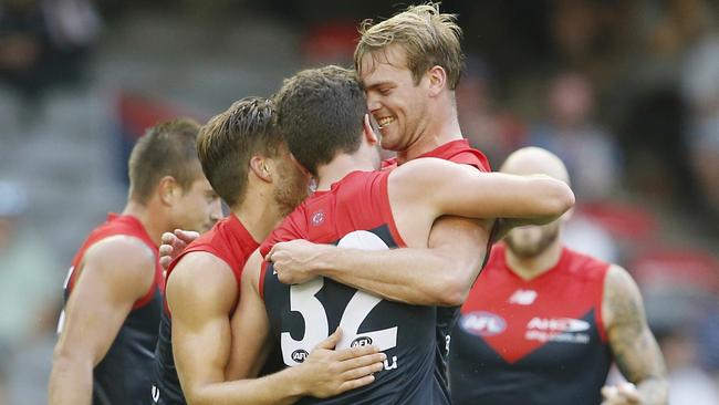 Jack Watts gves Tomas Bugg a cuddle after Bugg goaled. Pic: Michael Klein