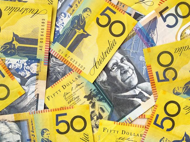 Background of Australian fifty dollar bills.  Full-frame. generic money, notes, cash.