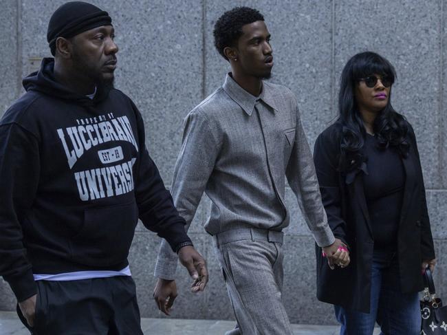 King Combs, pictured centre, arrives at court to support his father. Picture: AP/Yuki Iwamura