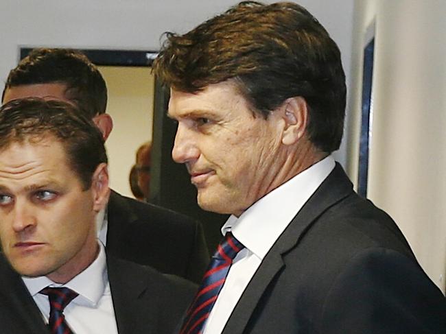 AFL Tribunal. Melbournes Jack Viney with coach Paul Roosand footy manager Josh Mahoney after Viney was suspended for 2 weeks after being found guilty of rough conduct. Pic: Michael Klein. Tuesday May 6, 2014.